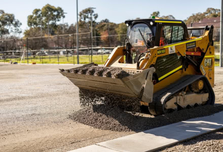 Bulldozer operating on a civil construction site, moving dirt.