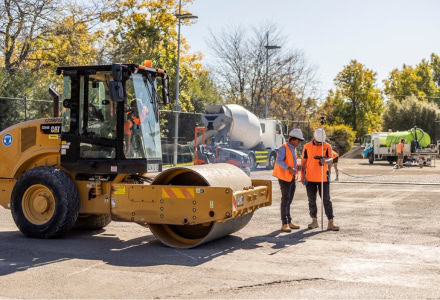 Civil construction site with workers and machinery in action.