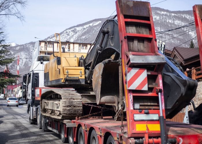huge truck trasnporting heavy equipment 